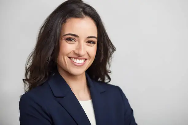 One businesswoman headshot smiling at the camera.