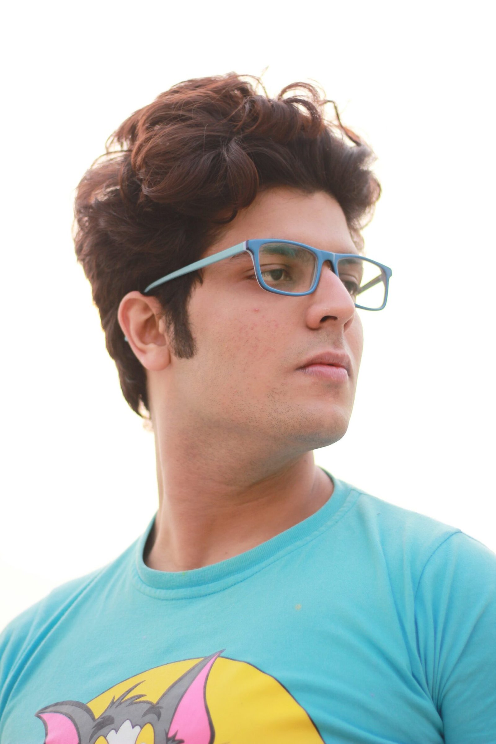 A man wearing glasses and a blue shirt