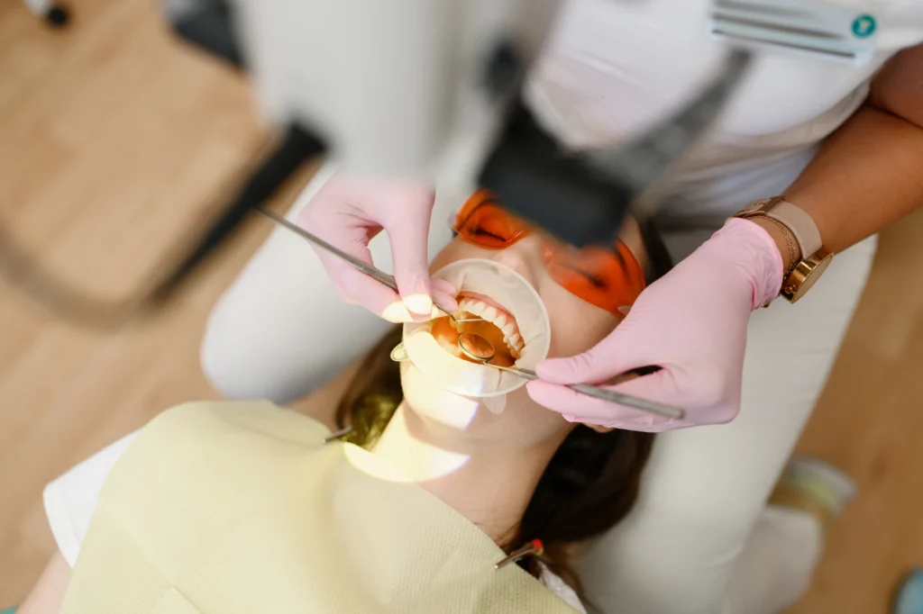 Female dentist and patient with opened mouth 2022 02 02 03 59 08 utc